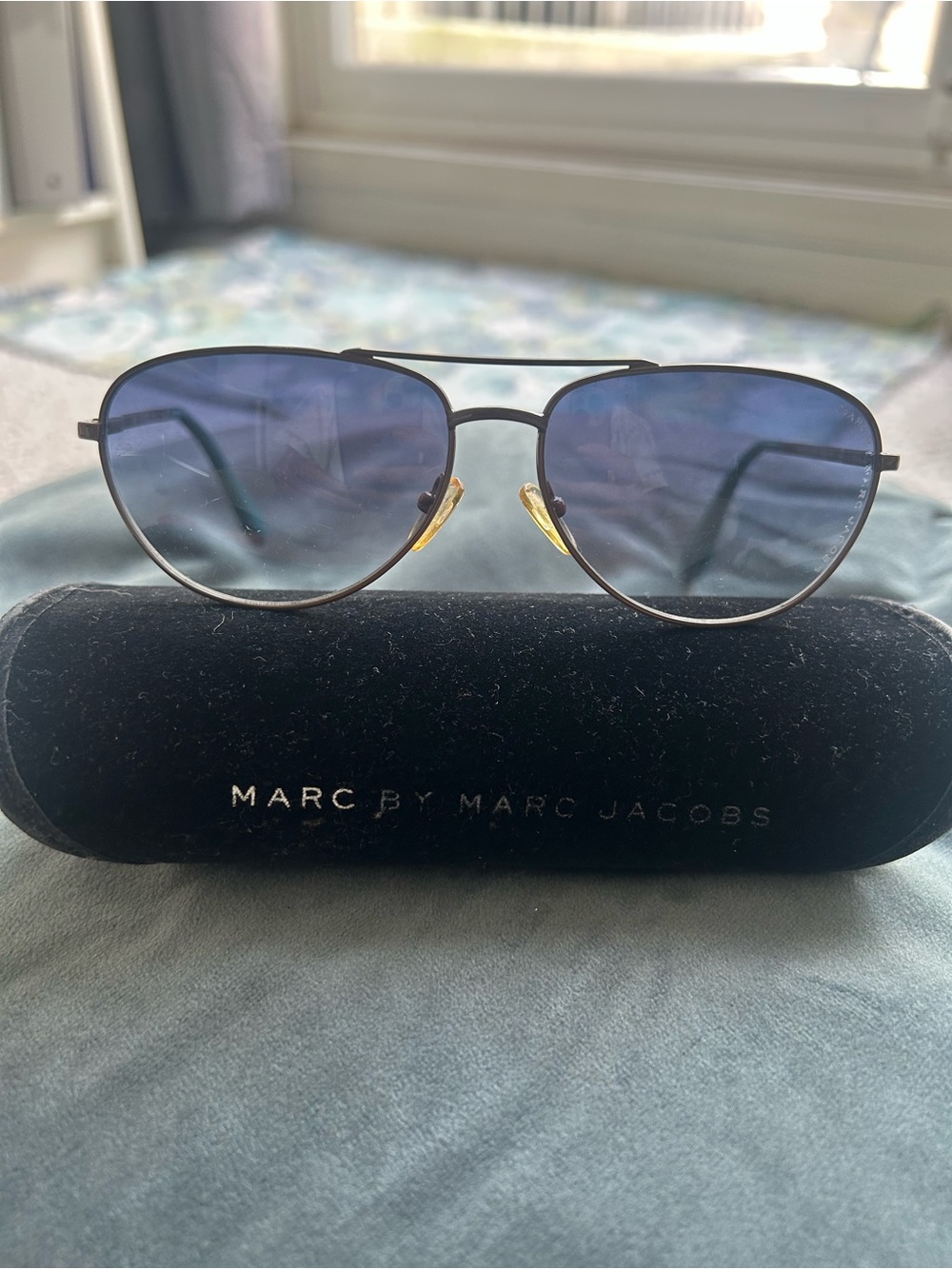 Marc By Marc Jacobs unisex Blue Lens Aviator Sunglasses with brown metal rims.